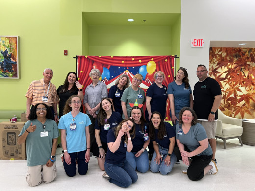 NICU Staff & Volunteers in a silly pose at the Graduation Reunion