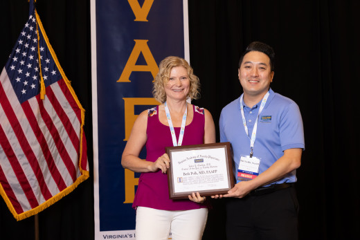 Dr. Polk receiving her award from VAFP President Timothy Yu, MD