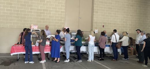 Tom Miller serving employees