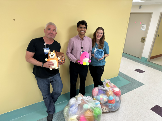 Tony, Dr. Reddy, Erika Trinkle with the donated squishmallows.