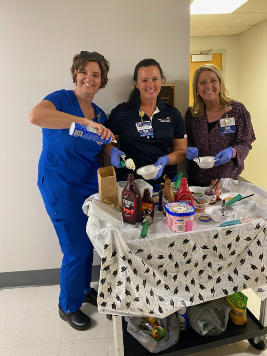 Nursing Leaders Joanna (ICU), Stephanie (ED) & Tracy (Senior Nursing Director) serving ice cream to the staff