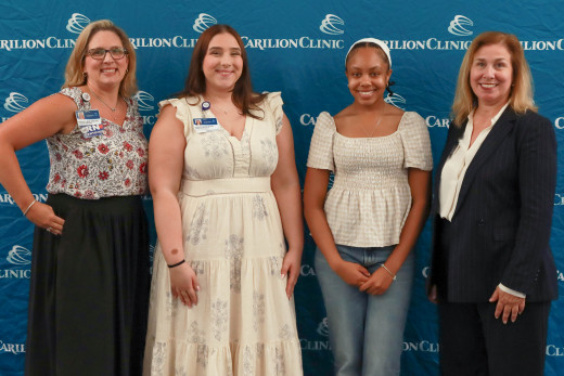 Kathryn Buzik and Nia Bright with their leaders,  Tara Wiedeman and Kristin Crouse