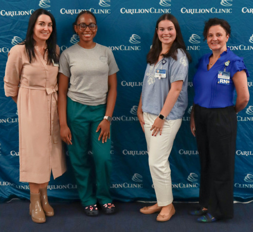Deborah Olorode and Audrey Kelley with their leaders,  Diana Lemon and Jamie Gheen 