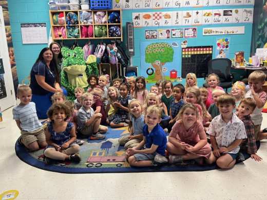 Students with Franklin the Frog, Angela & Stephanie