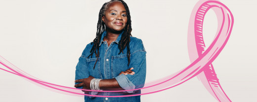 woman standing next to pink ribbon
