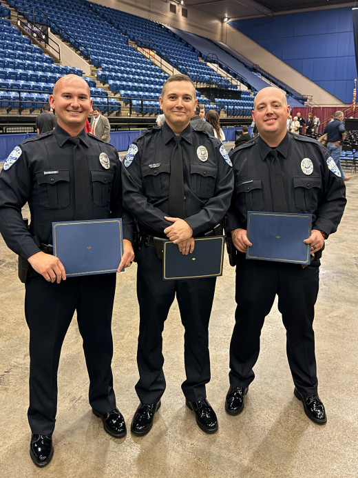 Officer J.E. St. Clair, Officer J.A. Sawicki and Officer D.K. Blankenship graduating image.