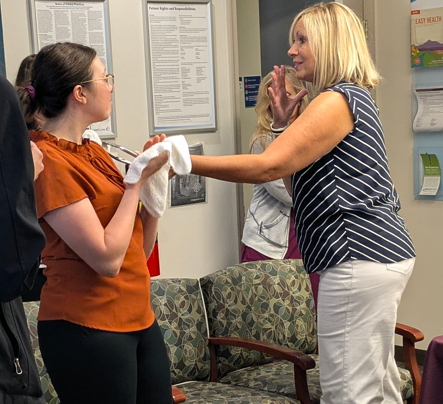 Wellness Programs Manager Julie Blanchard handing out aromatherapy cloths
