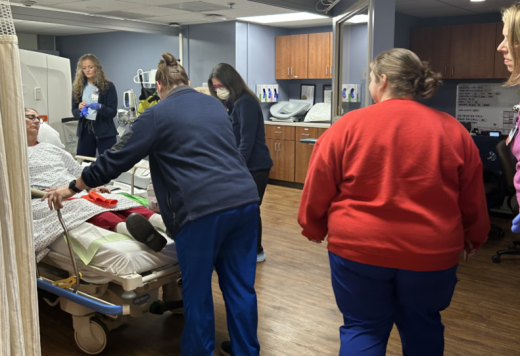CT Technologists preparing the patient for mock CT exams.