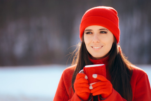 woman holding coffee cup