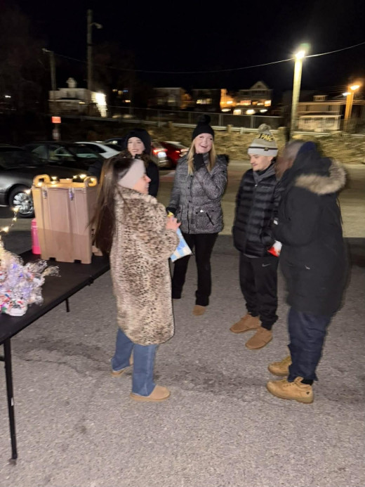 Olivia and friends greeting community members