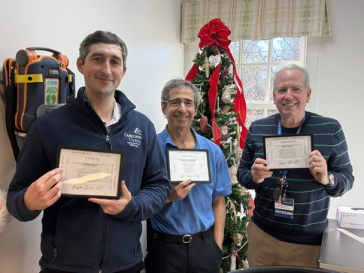 Dr. Todd, Glen Rivera, PA, and Dr. Todd with one of their gifts from the team