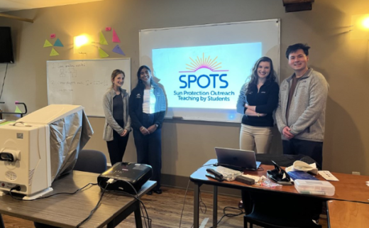 Medical students educating at a school within our community after being trained by Dr. Phillips