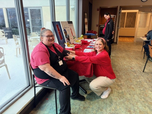 Stephanie Spencer, CGCH Health Educator, providing blood pressure screenings at heart health event.