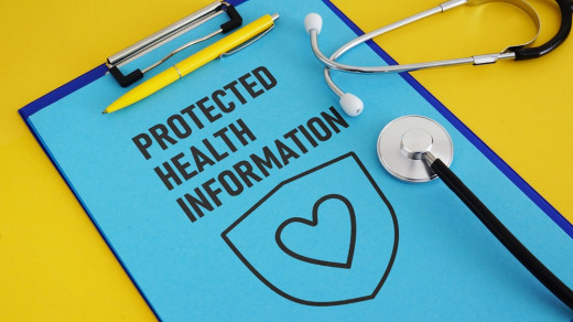 paper on clipboard that says protected health information