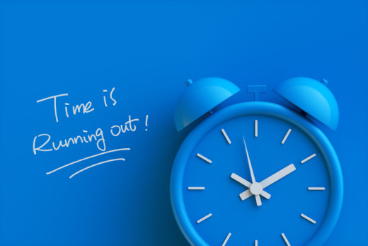 clock with the words "time is running out" next to it