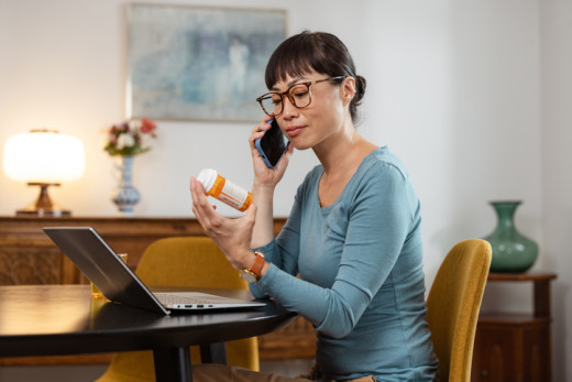 woman calling pharmacy about a prescription
