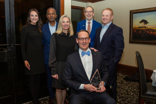 Dr. Herman, poses with Carilion leaders and Children's Miracle Network Representatives