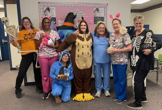 Pictured left to right. Skeley, Taylor Roach, Sharon Jennings, Stitch, Maria Hernandez, Teresa Williams, Kathy Crimmins, Tammy Allen, Gail Hix