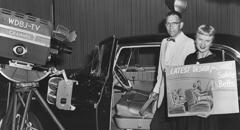 Dr. Ripley helping to educate about seatbelt safety in 1958