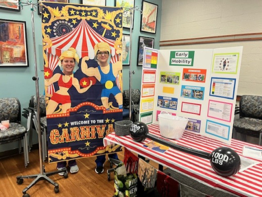 Kelly Carr and the Early Mobility Team booth