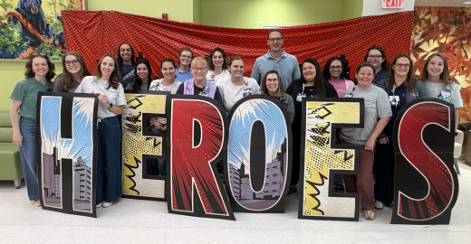 Some of the NICU Staff posing with a HEROES sign