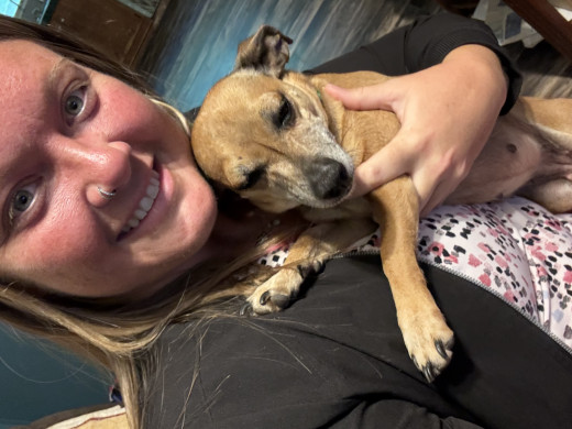 CNA Sabrina holding the retrieved dog