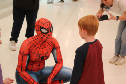 Spiderman talking to a NICU Graduate