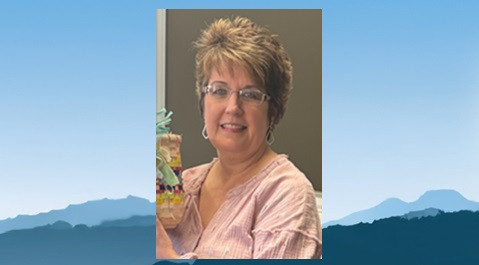 Barbara Gilbert on mountain background
