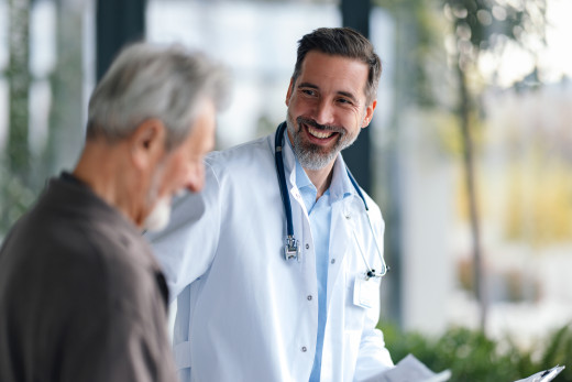 doctor talking to elderly patient