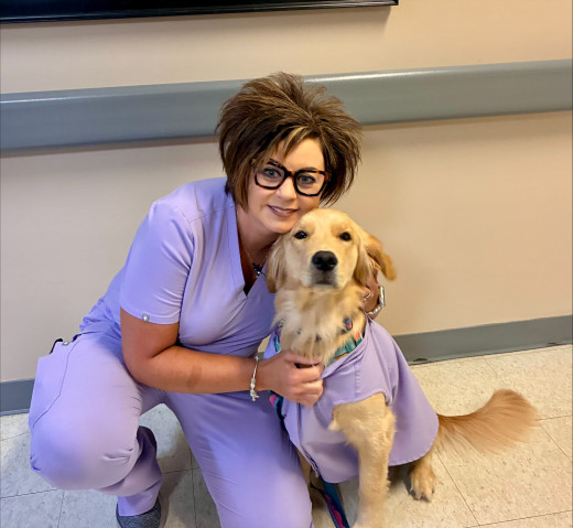 Meadow and Tazewell employee in matching purple scrubs