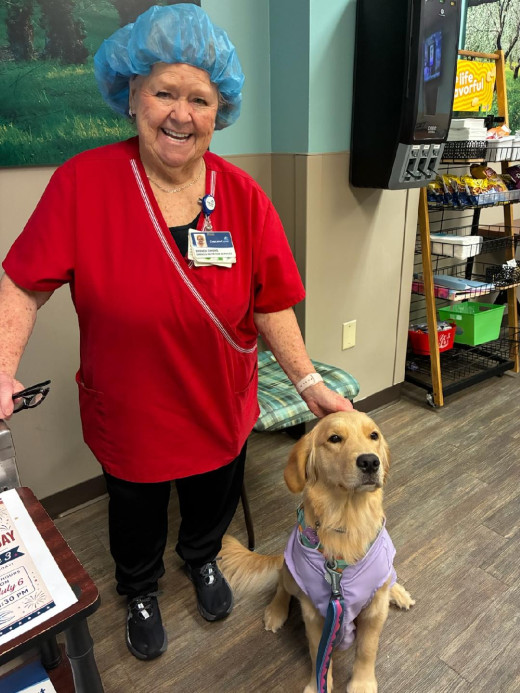 Meadow visiting with dietary team member at Tazewell