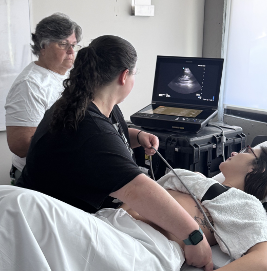 Dr. Carol "CB" Bernier teaching intern Phoebe Livingston