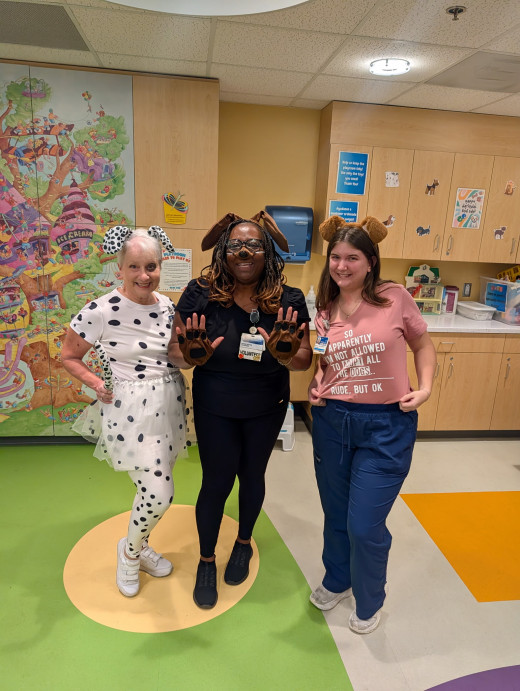 Child Life Volunteers Colleen & Debbie with Child Life Assistant, Bailey