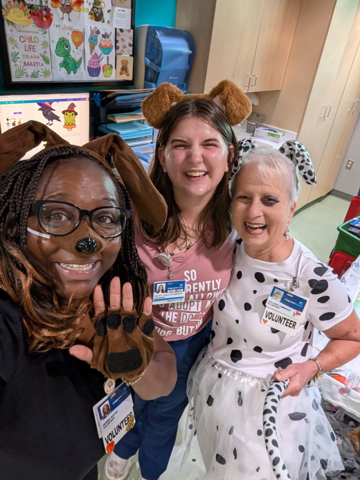 Child Life Volunteers Colleen & Debbie with Child Life Assistant, Bailey