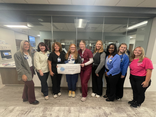 Jewel Wood (center) and CVI leaders, nursing leaders, and staff