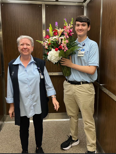 Youth Volunteer Delivers Flowers