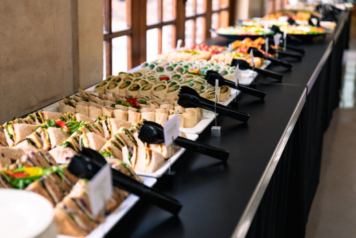 A table displaying an assortment of catered food.