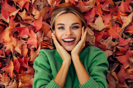 Woman lying in leaves