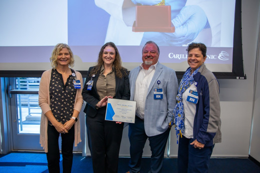 From left to right: Dr. Beth Polk, Christina Gardner, PA, Jeremy Brookman, and Trish Frazier accepted the Well-Being Team Gold award on behalf of Family and Community Medicine.